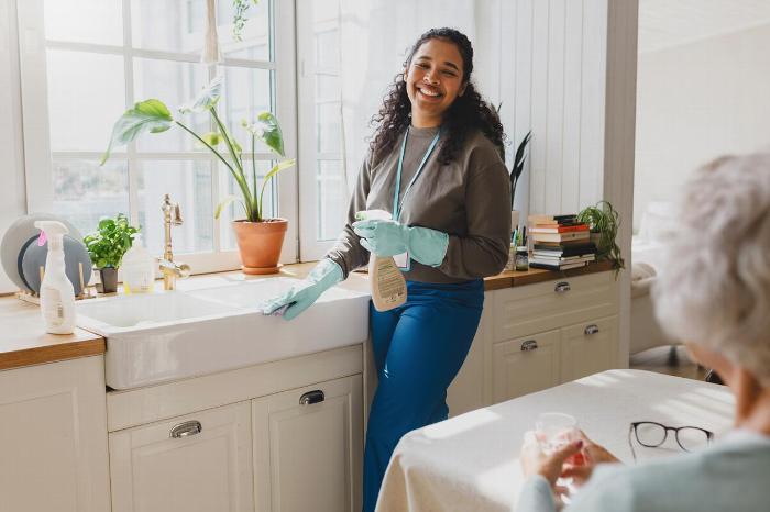 A carer helping with the washing up